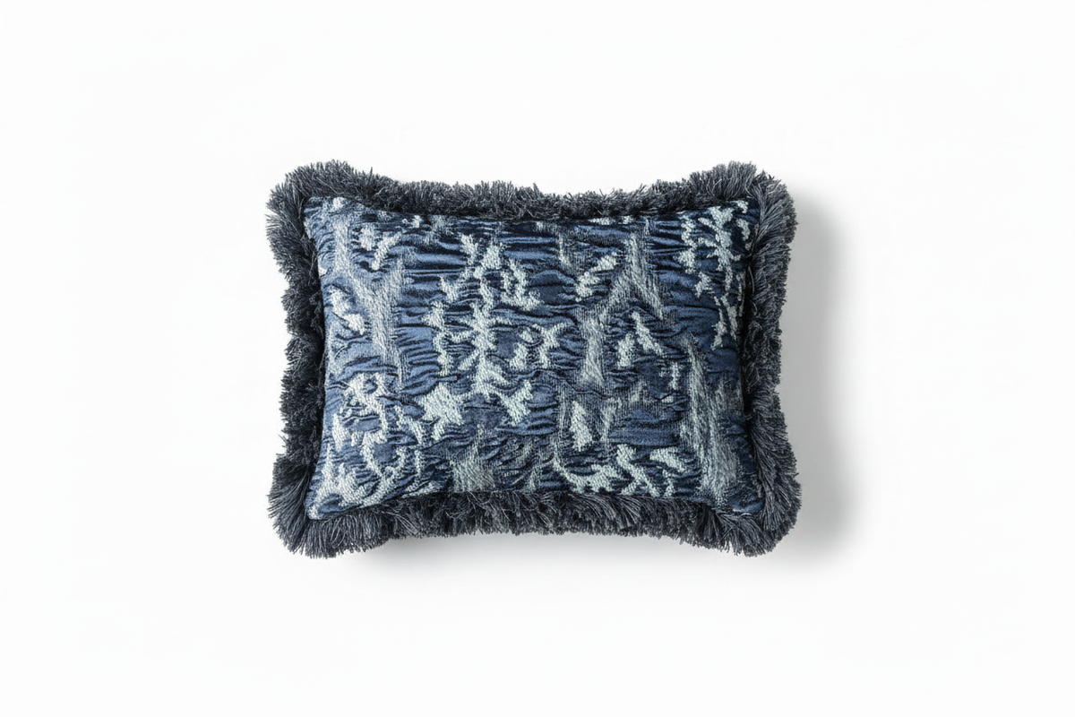 Cushion with geometric pattern and dark grey fringes
