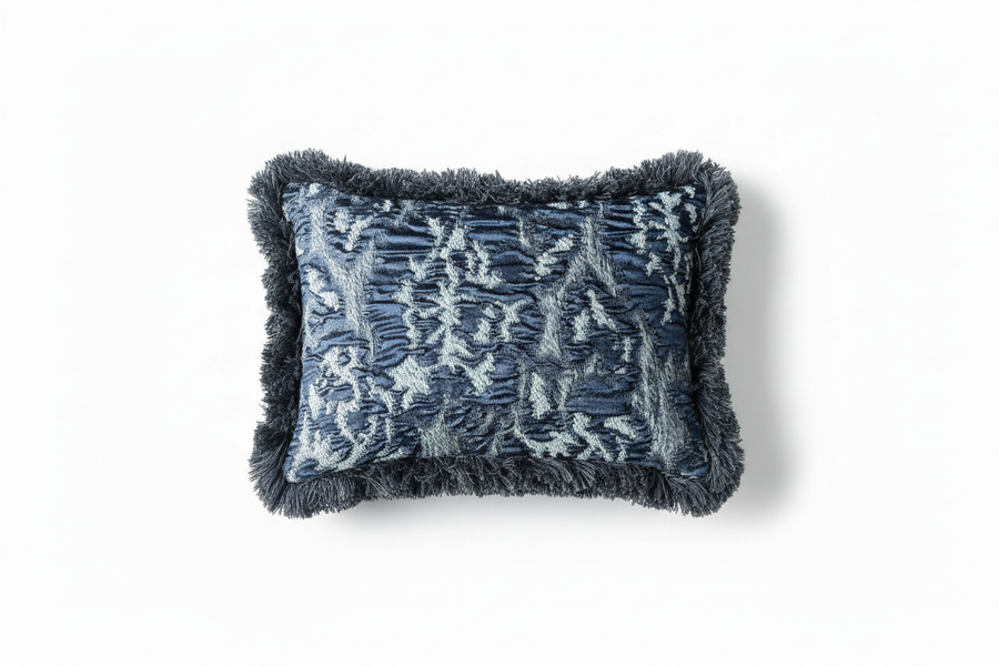 Cushion with geometric pattern and dark grey fringes